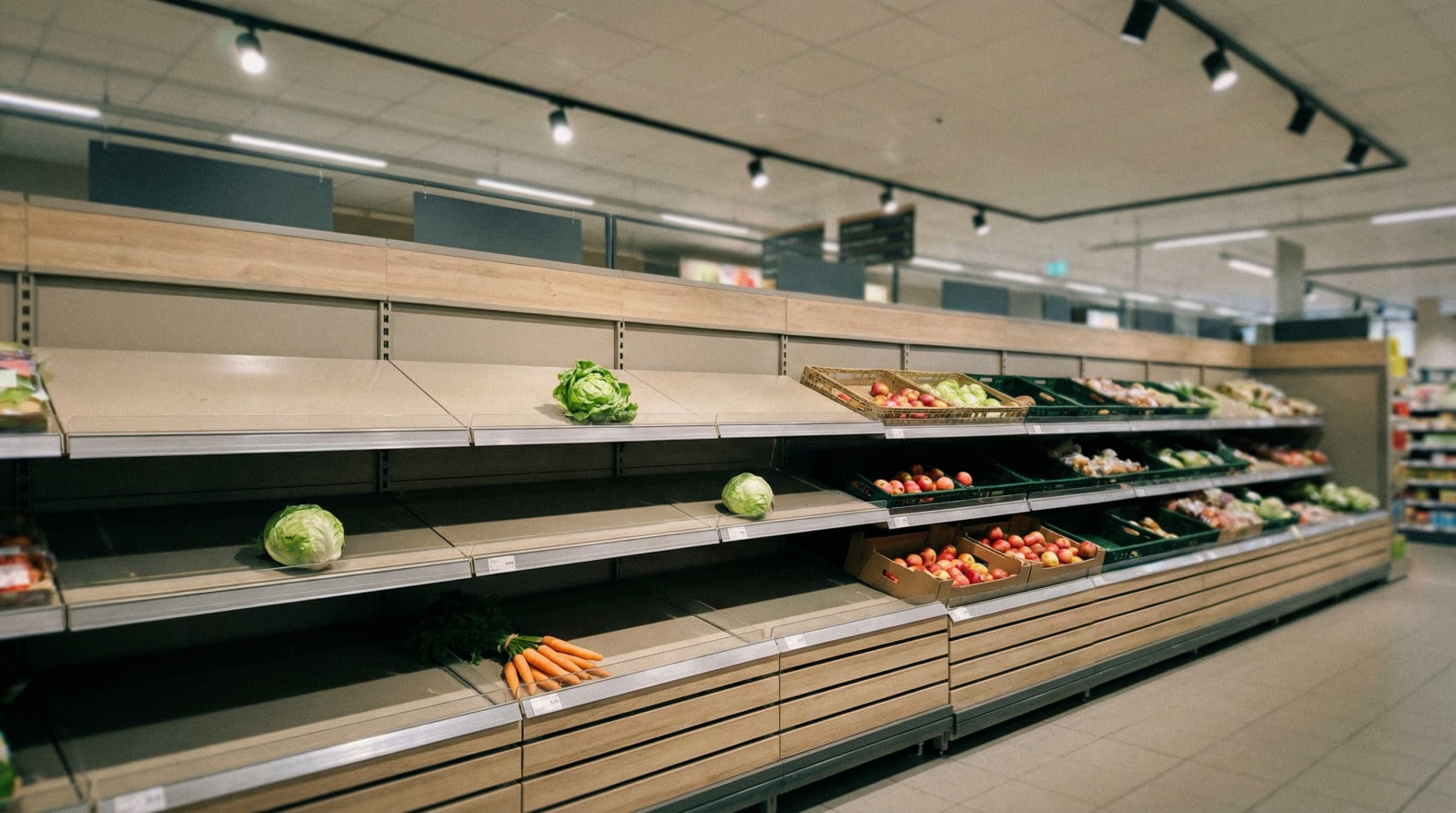 sparse produce aisle in modern supermarket
