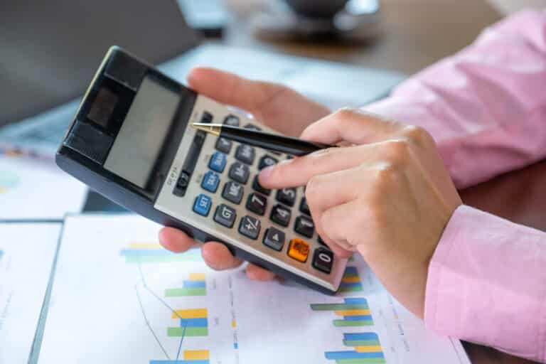 businessmen bookkeeper hand use calculator and laptop doing acco